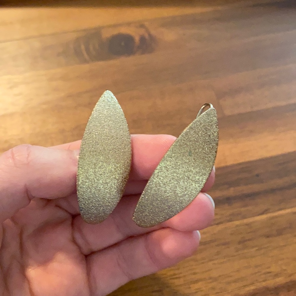 Gold tone leaflike earrings